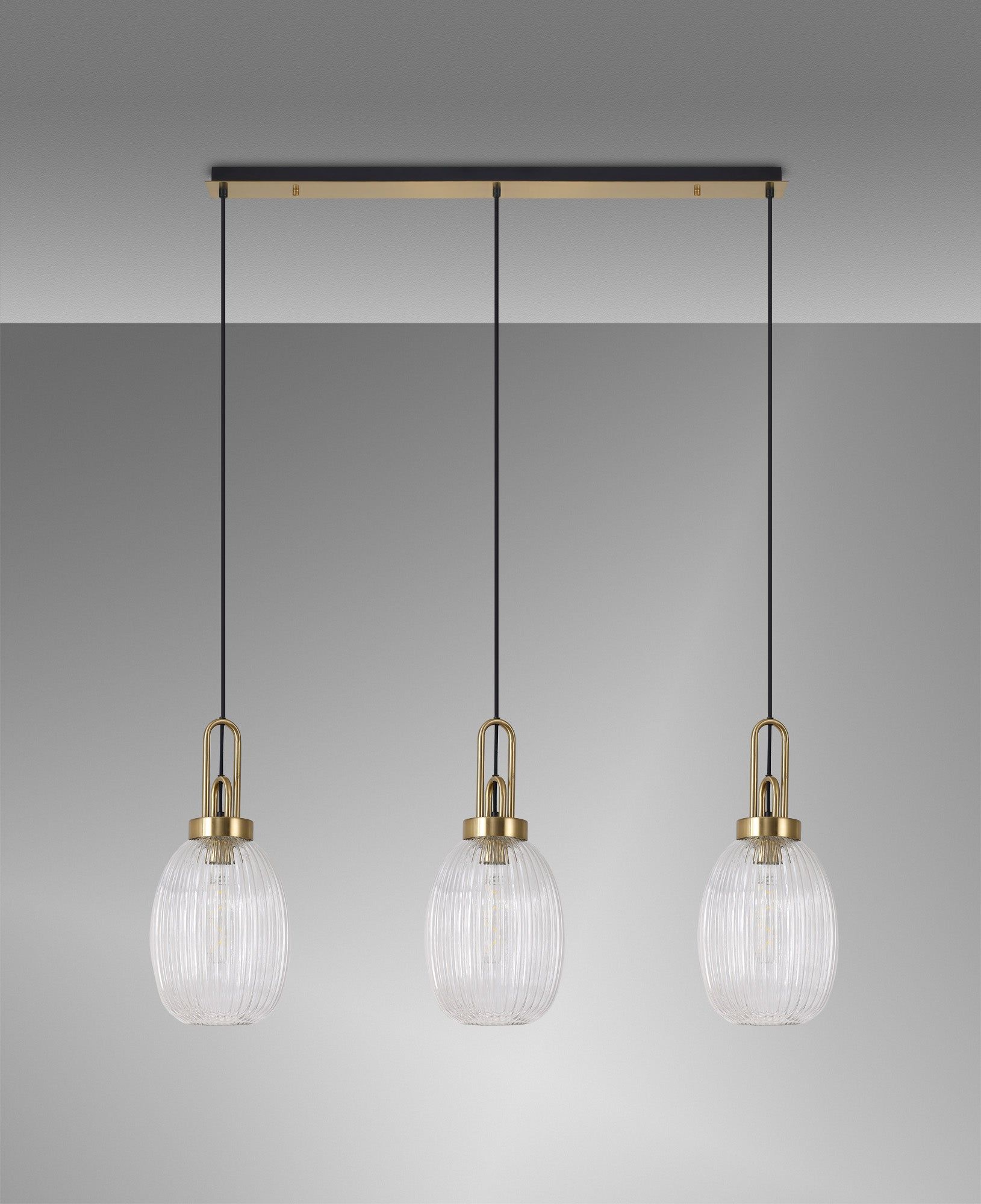 Cadiz Linear 3 Light Pendant E27 With 20cm Almond Ribbed Glass, Clear Brass Gold/Matt Black
