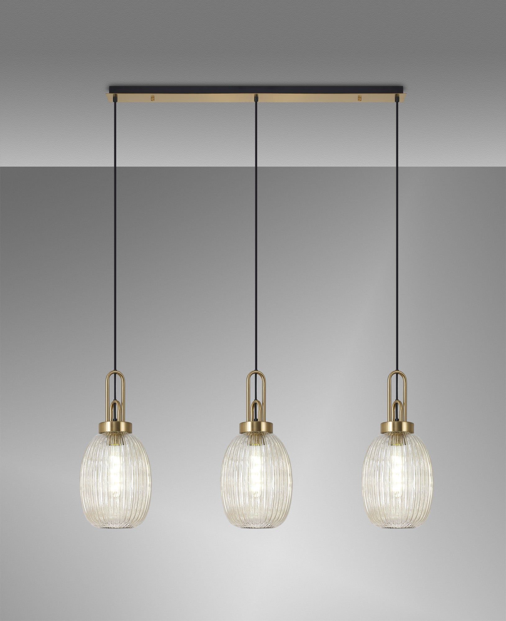 Cadiz Linear 3 Light Pendant E27 With 20cm Almond Ribbed Glass, Champagne Brass Gold/Matt Black